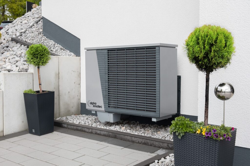 pexels photo 20046694 20046694 Modern air conditioning unit with flower pots and sleek decor outdoors.